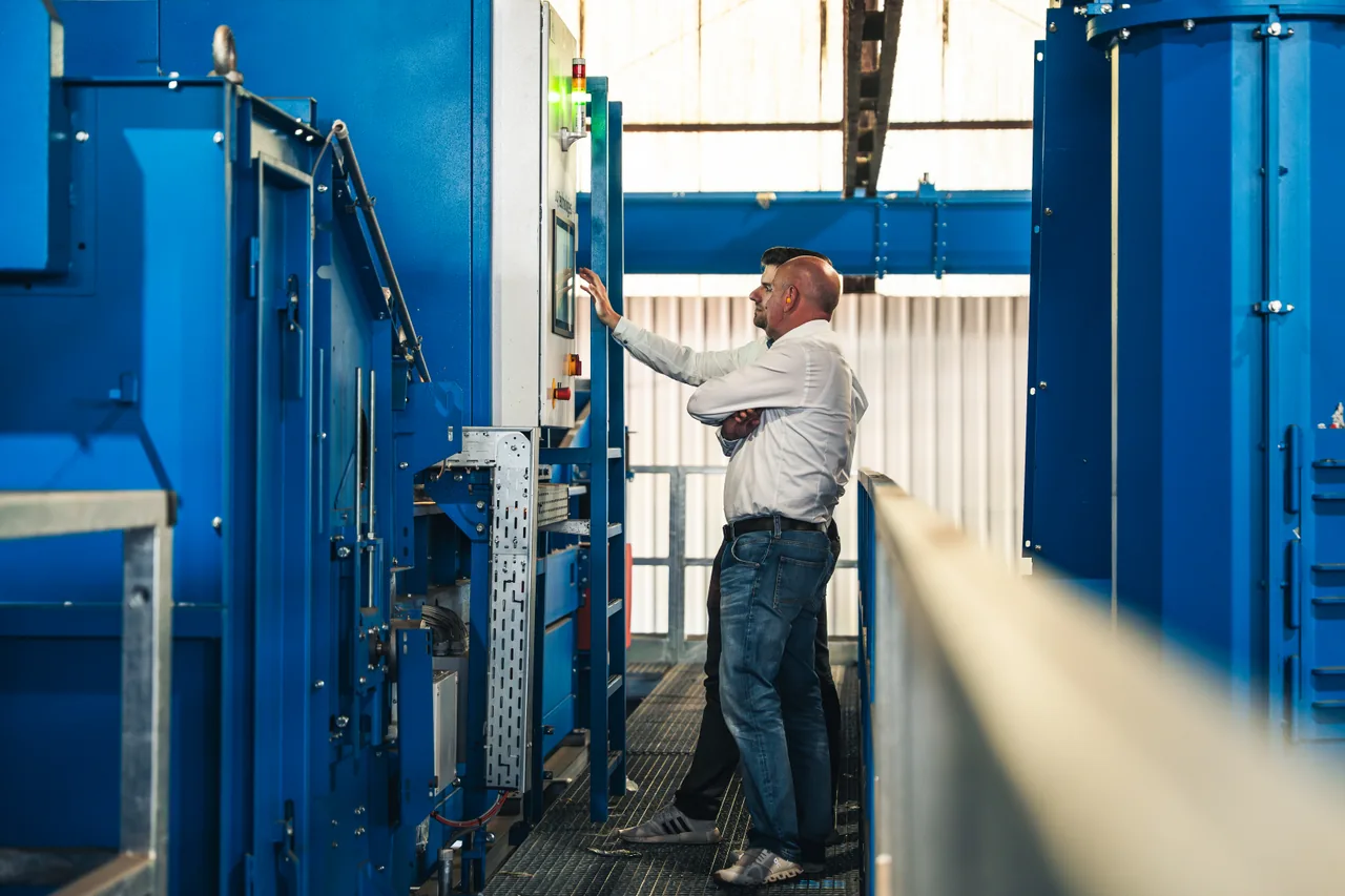Operators working at a UCY bottle sorting line